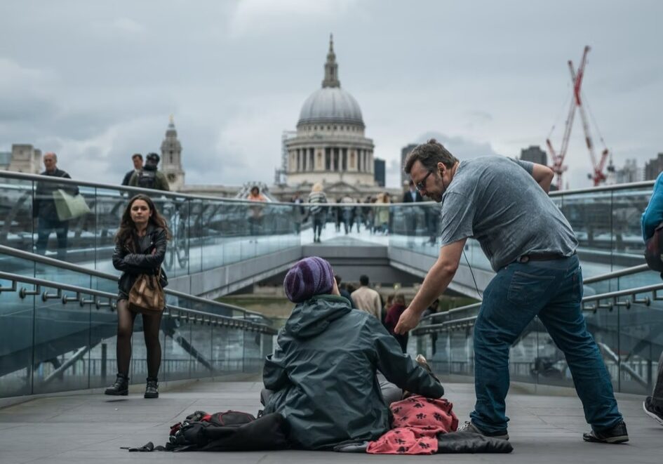 Man giving money to homeless